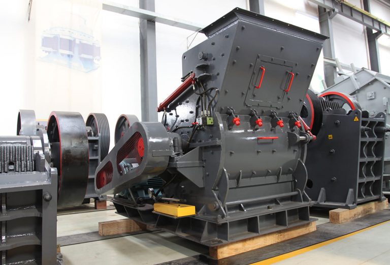 How is coal ground using a hammer mill?